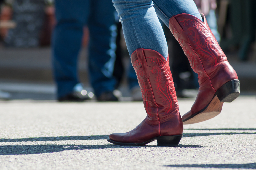 Closeup,Of,Woman,Legs,With,Red,American,Boots,At,Country